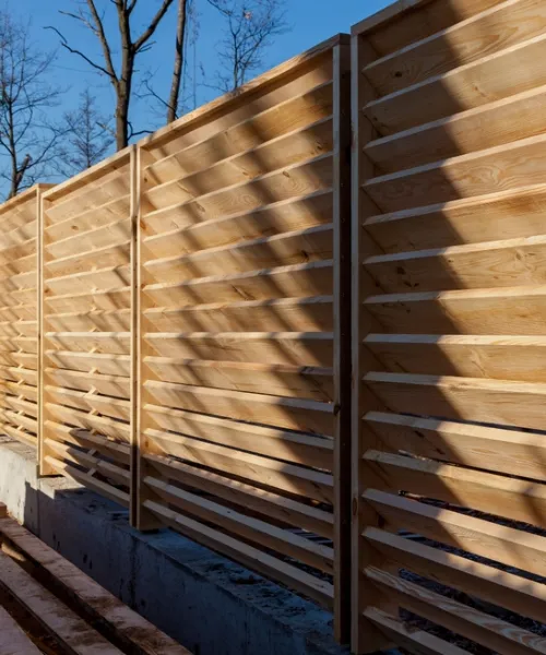 Modern fencing and privacy screen installed for a secure residential outdoor area