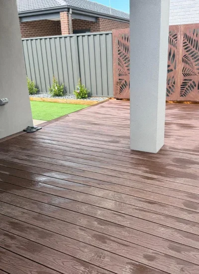 Client receiving practical aftercare advice after a completed landscaping project